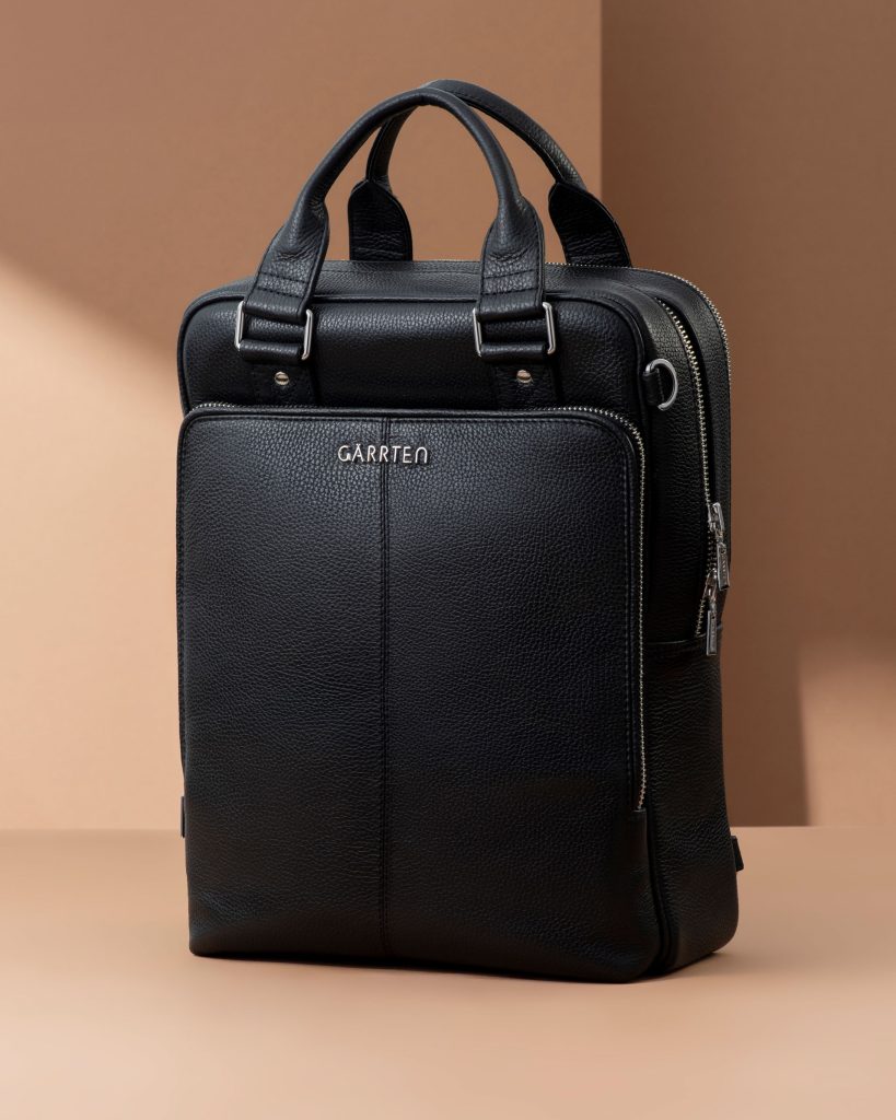 Black leather briefcase laptop bag with silver zippers and handles.