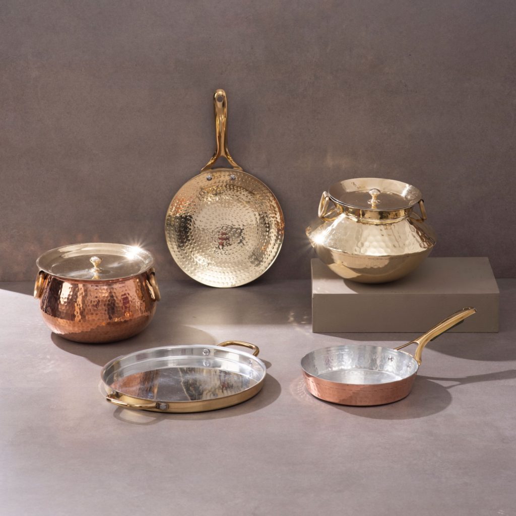 Copper and brass cookware collection with pots pan kadai and serving dishes