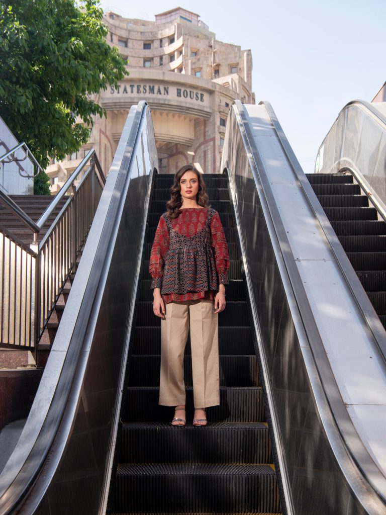 Red black tunic Shoot at escalator urban fashion photography by Sandeep Vishwakarma