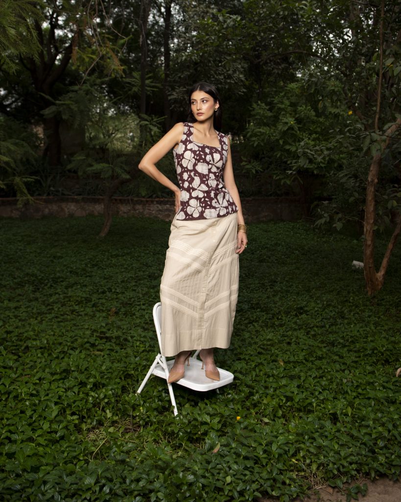 Sleeveless floral top and ivory skirt shoot at garden by sandeep vishwakarma