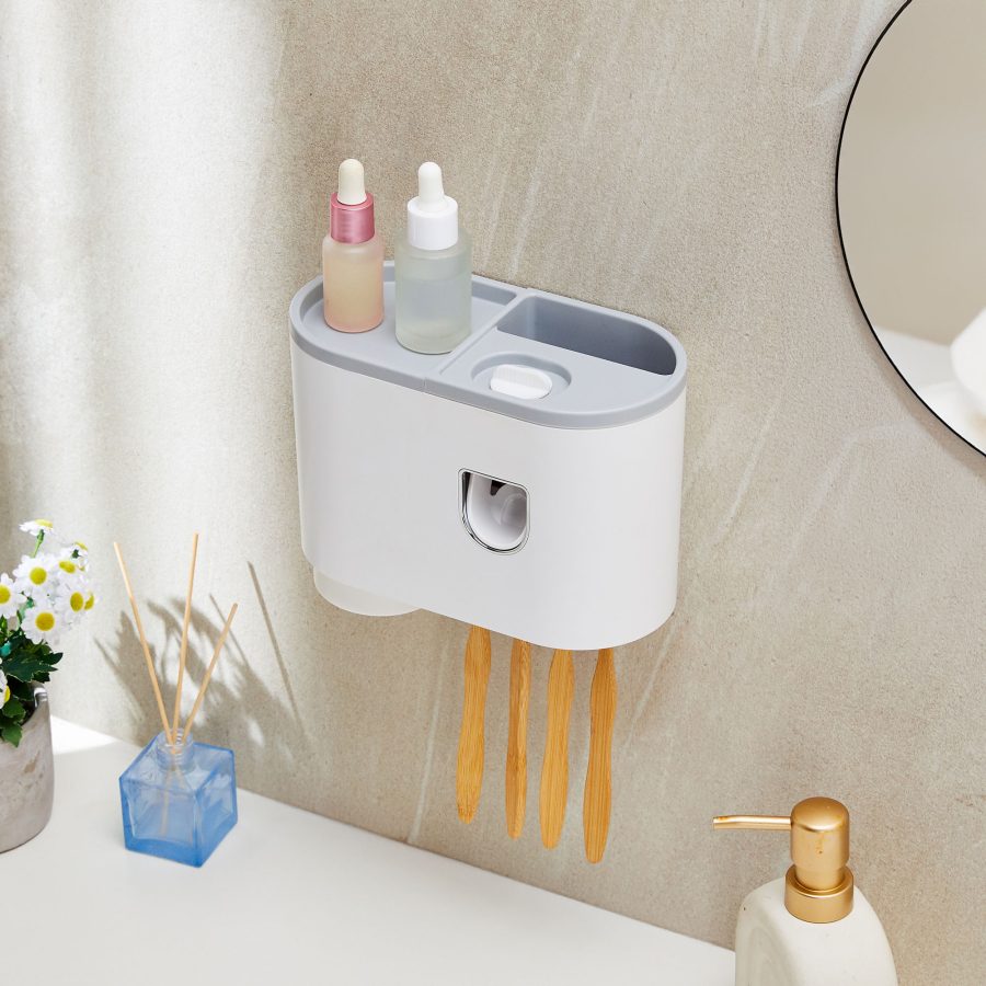 Wall mounted bathroom organizer with skincare bottles, toothbrush slots, cups and bathroom decor
